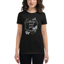 Load image into Gallery viewer, woman modeling/wearing women&#39;s black t-shirt. Image Design: Text &quot;Always trust your Intuition,&quot; with plant/vine border, watercolor style moths, stars
