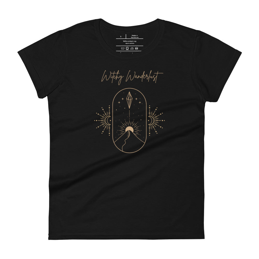 Woman's black t-shirt with image phrase: Witchy Wanderlust. Image under phrase is a minimalist hill with a sun behind, stars in the sky, and crystal suspended above the hill. Bordered with crescent moon on either side. Front view. Halloween, spooky season.