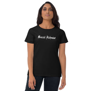 woman modeling/wearing woman's black t-shirt, with Image phrase: white text - "Mental Alchemist." Front view.