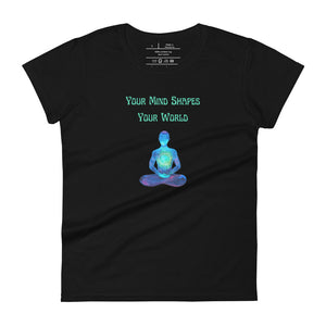 women's black t-shirt with image phrase: "Your mind shapes your world." With a green blue watercolor image graphic of a person's silhouette, in pose of meditation. Front view.