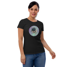 Load image into Gallery viewer, woman modeling/wearing women&#39;s black t-shirt, with image design: side profile of a skull wearing a crown/hat of black roses, red berries, thorny vines and leaves, with a blue-purple moon behind it. Front View.
