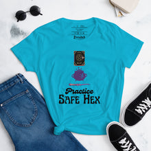 Load image into Gallery viewer, Woman&#39;s light blue t-shirt with image phrase: Practice safe Hex (play on words for &#39;Practice safe sex.&#39; Above phrase is a spell book, a cauldron, a wand. Front view. Halloween, spooky season.
