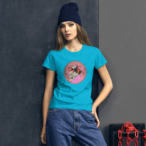 woman modeling/wearing women's caribbean blue t-shirt, with image design: side profile of a skull wearing a crown/hat of black roses, red poppies, thorny vines, and white butterflies, with a pink-red moon behind it. Front View.