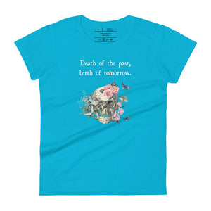 women's caribbean blule t-shirt with image design of a skull with plants, mushrooms, roses, and flowers growing out of it, with white butterflies, and image phrase "Death of the Past, Birth of Tomorrow." Front view.