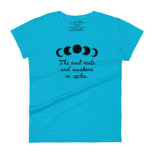 Load image into Gallery viewer, women&#39;s caribbean blue t-shirt, with image of black celestial moon phases, with star cut outs, and image phrase &quot;The soul rests and awakens in cycles.&quot; Front view.
