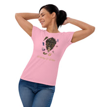 Load image into Gallery viewer, Woman modeling/wearing woman&#39;s light pink t-shirt with image phrase: Witchy &amp; Wild, with image of woman&#39;s head with antlers, and stars in her hair. Circling her head are crystals, frog, snail, fern leaf, bunch of flowers, mushroom. Front view. Halloween, spooky season.
