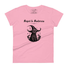 Load image into Gallery viewer, Woman&#39;s light pink t-shirt with image phrase: Magical &amp; Mischievous, with image of black cat wearing a black hat underneath. Front view. Halloween, spooky season.
