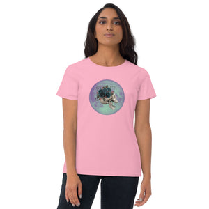 woman modeling/wearing women's charity pink t-shirt, with image design: side profile of a skull wearing a crown/hat of black roses, red berries, thorny vines and leaves, with a blue-purple moon behind it. Front View.