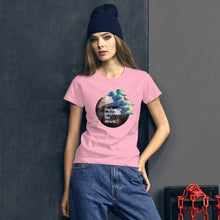 Load image into Gallery viewer, woman modeling/wearing women&#39;s charity pink t-shirt with image design of a dark moon, with a colorful dawn cloud in front, with image phrase: &quot;Darkness precedes the Dawn.&quot; Front View.
