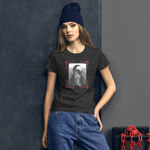 Load image into Gallery viewer, woman wearing/modeling women&#39;s heather grey t-shirt with image of a psychic tarot reader, with tarot cards in hand, crescent moon in background, red crescent moon corner borders
