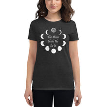 Load image into Gallery viewer, Woman modeling/wearing woman&#39;s dark heather grey t-shirt with image phrase: The moon made me do it. Bordered with Moon phases. Front view. Halloween, spooky season.
