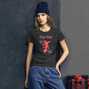 Woman modeling/wearing woman's dark heather grey t-shirt with image phrase: Stay Hexy (play on words for Stay Sexy), red silhouette of pretty witch form, pentacle stars on both side. Front view. Halloween, spooky season.