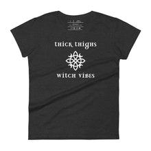 Load image into Gallery viewer, Woman&#39;s dark heather grey t-shirt with image phrase: thick thighs, witch vibes. Witch&#39;s knot, with crescent moons, and star in the middle. Front view. Halloween, spooky season.
