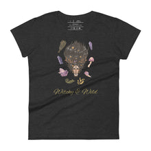 Load image into Gallery viewer, Woman&#39;s dark heather grey t-shirt with image phrase: Witchy &amp; Wild, with image of woman&#39;s head with antlers, and stars in her hair. Circling her head are crystals, frog, snail, fern leaf, bunch of flowers, mushroom. Front view. Halloween, spooky season.
