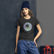 Load image into Gallery viewer, woman modeling/wearing women&#39;s dark grey heather t-shirt, with image design: side profile of a skull wearing a crown/hat of black roses, red berries, thorny vines and leaves, with a blue-purple moon behind it. Front View.
