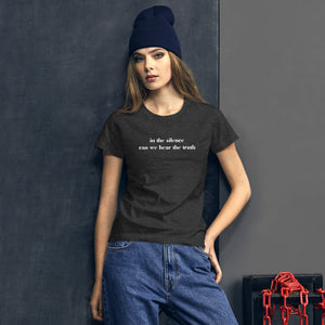 woman modeling/wearing women's heather dark grey t-shirt, with image phrase: "in the silence can we hear the truth." Front view.