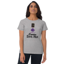 Load image into Gallery viewer, Woman modeling/wearing woman&#39;s light grey t-shirt with image phrase: Practice safe Hex (play on words for &#39;Practice safe sex.&#39; Above phrase is a spell book, a cauldron, a wand. Front view. Halloween, spooky season.
