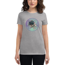 Load image into Gallery viewer, woman modeling/wearing women&#39;s heather grey t-shirt, with image design: side profile of a skull wearing a crown/hat of black roses, red berries, thorny vines and leaves, with a blue-purple moon behind it. Front View.
