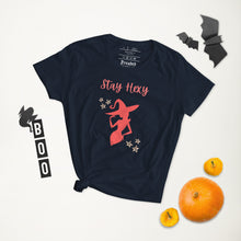 Load image into Gallery viewer, Woman&#39;s navy t-shirt with image phrase: Stay Hexy (play on words for Stay Sexy), red silhouette of pretty witch form, pentacle stars on both side. Front view. Halloween, spooky season.
