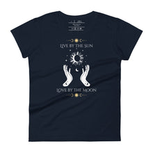 Load image into Gallery viewer, women&#39;s navy blue t-shirt. Image Design: Text &quot;Live by the Sun, Love by the Moon,&quot; with two hands encircling image of sun, moon below, stars all around. Sun, moon, star top &amp; bottom border.
