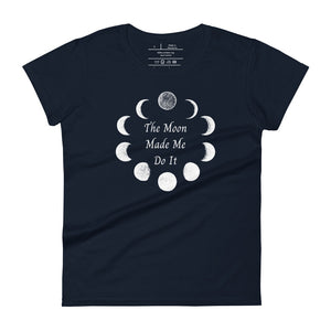 Woman's navy blue t-shirt with image phrase: The moon made me do it. Bordered with Moon phases. Front view. Halloween, spooky season.