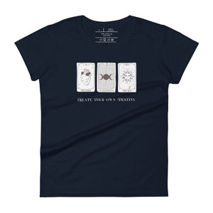 Woman's navy blue t-shirt with image phrase: Create your own destiny, with 2 tarot cards, representing past, present, future. Front view. Halloween, spooky season.