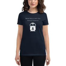 Load image into Gallery viewer, Woman modeling/wearing woman&#39;s navy blue t-shirt with image phrase: Brew spells, not tea (pinche chismosa). Underneath words is an image of a cauldron decorated with stars and skull with crossbones. Front view. Halloween, spooky season.
