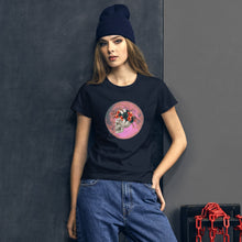 Load image into Gallery viewer, woman modeling/wearing women&#39;s nvy t-shirt, with image design: side profile of a skull wearing a crown/hat of black roses, red poppies, thorny vines, and white butterflies, with a pink-red moon behind it. Front View.
