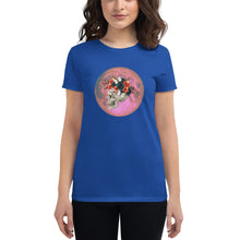 Load image into Gallery viewer, woman modeling/wearing women&#39;s royal blue t-shirt, with image design: side profile of a skull wearing a crown/hat of black roses, red poppies, thorny vines, and white butterflies, with a pink-red moon behind it. Front View.
