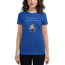 Load image into Gallery viewer, woman modeling/wearing women&#39;s royal blue t-shirt, with image phrase: &quot;The quiet mind hears the Universe.&quot; Image of watercolor pink and blue lotus flower floating on water.
