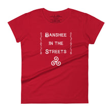 Load image into Gallery viewer, Woman&#39;s red t-shirt with image phrase: Banshee in the Streets, tribal symbols on both sides. Triskele at the bottom under phrase. Front view. Front view. Halloween, spooky season.
