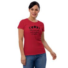 Load image into Gallery viewer, woman modeling/wearing women&#39;s red t-shirt, with image of black celestial moon phases, with star cut outs, and image phrase &quot;The soul rests and awakens in cycles.&quot; Front view.
