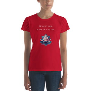 woman modeling/wearing women's true red t-shirt, with image phrase: "The quiet mind hears the Universe." Image of watercolor pink and blue lotus flower floating on water.