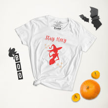 Load image into Gallery viewer, Woman&#39;s white t-shirt with image phrase: Stay Hexy (play on words for Stay Sexy), red silhouette of pretty witch form, pentacle stars on both side. Front view. Halloween, spooky season.
