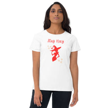 Load image into Gallery viewer, Woman modeling/wearing woman&#39;s white t-shirt with image phrase: Stay Hexy (play on words for Stay Sexy), red silhouette of pretty witch form, pentacle stars on both side. Front view. Halloween, spooky season.
