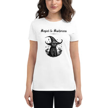 Load image into Gallery viewer, Woman modeling/wearing woman&#39;s white t-shirt with image phrase: Magical &amp; Mischievous, with image of black cat wearing a black hat underneath. Front view. Halloween, spooky season.
