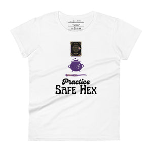 Woman's white t-shirt with image phrase: Practice safe Hex (play on words for 'Practice safe sex.' Above phrase is a spell book, a cauldron, a wand. Front view. Halloween, spooky season.